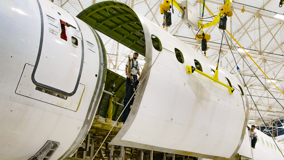 embraer's tweet image. Take a look at our new door frame on the first #E190 passenger-to-freighter conversion. Our P2F E-Jet conversion program is progressing smoothly, right on schedule. #WeAreEmbraer #EmbraerStories #Freighter #cargo #EJets #HighTech #VeryHuman