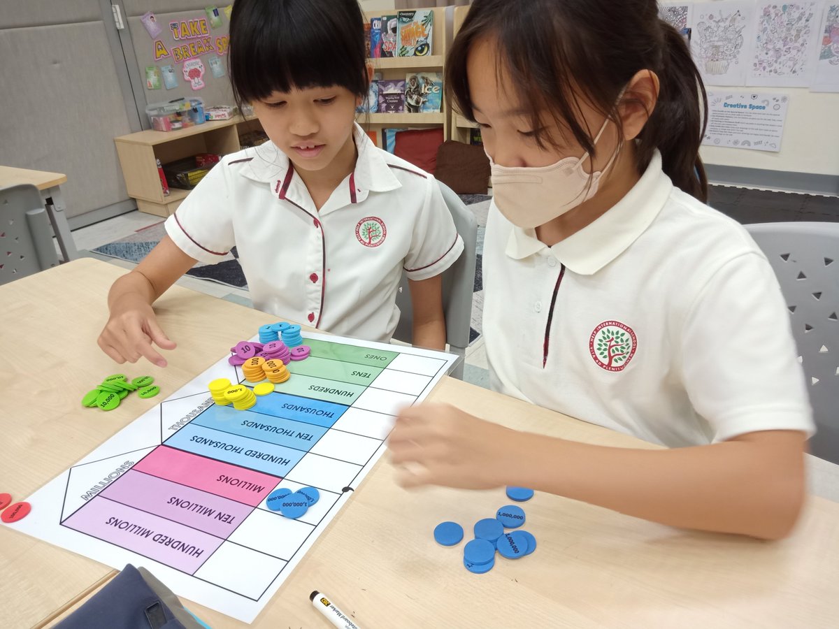 HISYear5's tweet image. Year 5s getting reacquainted with whole numbers using the math tokens and place value chart 📊

#HIS_Learning