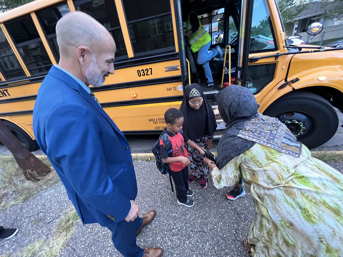 NOW: St. Paul schools superintendent Joe Gothard and education assistant Ubah Jama greet students at the district’s new East African Elementary Magnet school for the first day of the 23-24 school year.