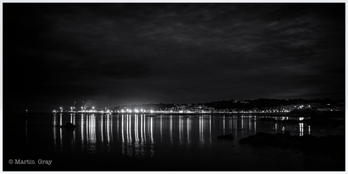 'Morning Skyline'... 🌖 St Peter Port skyline, lovely ripples in the foreground, reflections in the centre and puffy cloud to soften the dark sky... #loveguernsey #stpeterport #blackandwhitephotography #reflections #guernseylandscape #guernseylife #guernseyskyline