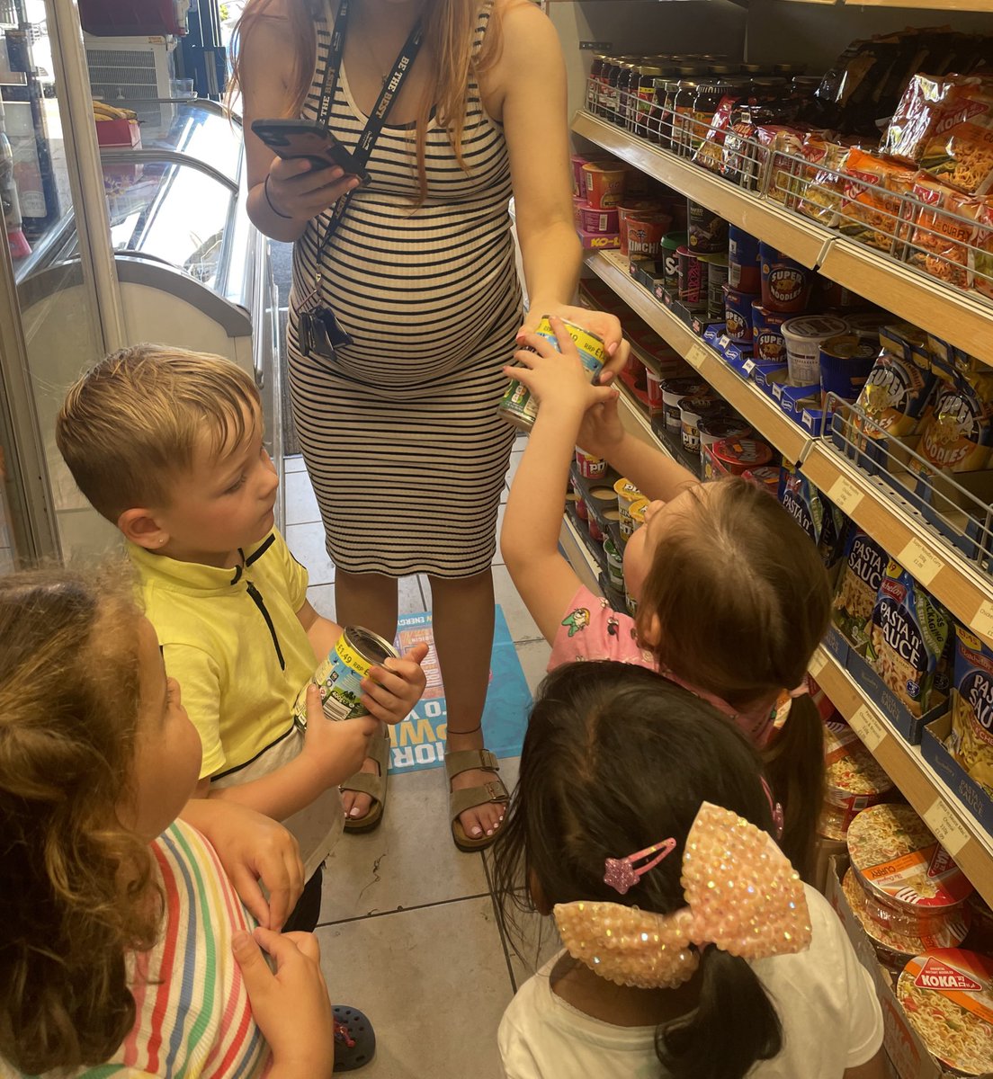 WhitecrookE's tweet photo. Promoting social and cultural capital through experiences within the community of Whitecrook. 

We took a trip to our local shop to buy some custard for our rhubarb crumble ⭐️! Working together to count the money and carry the custard back to nursery https://t.co/nNH2ViUBxs