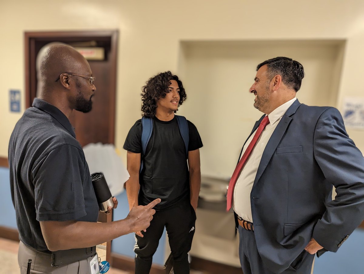 Superintendent Peluso and Principal Danko-Harris talking football and the future with West Point recruit Anthony Diaz at World of Inquiry School. #OneRCSD
