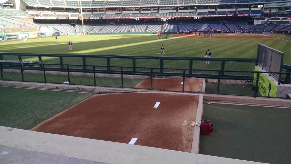 TrevRosenthal's tweet photo. MLB Bullpen Review #8

Los Angeles Angels

The west coast climate is the best for a pitcher. Consistent temperatures and air density make gripping the ball more predictable. 

Angel Stadium (The Big A) has one of the shortest dimensions to the outfield wall from home plate. The bullpens are placed in dead left field just beyond the warning track and wall. Both team bullpens stacked on one another and after a few years I have given up on guessing which belongs to whom.

I am sure fans would like this area to replaced with ticked seating. For the field view, catching home run balls and proximity to the fire torch in the centerfield rockpile. 

My favorite aspect to pitching in Angel Stadium is not that it is close to Disney Land. It is that this is the last standing stadium the great Nolan Ryan called home. 

Now, access to the bullpen from the visiting clubhouse can be found through navigating a maze of stadium service corridors. After passing the home clubhouse and wrapping back behind the outfield bleachers, the field access tunnel for grounds crew and paramedics leads to the bullpen door. 

Finally, the most interesting aspect of the Angel Stadium bullpen is the shared restroom. Whether or not the rivalry is serious, it is still required to show courtesy while seeking relief. 

Overall score: 8.5/10

Pros:
1. West coast climate
2. Easy access from clubhouse

Cons:
1. Required to show courtesy to opponent 
2. Fans envy the seating location

Bonus:
As one of the few remaining multi sport stadiums, the seating is designed to offer more seats close to the action. This is noticeable as a player on the field and creates a great experience.