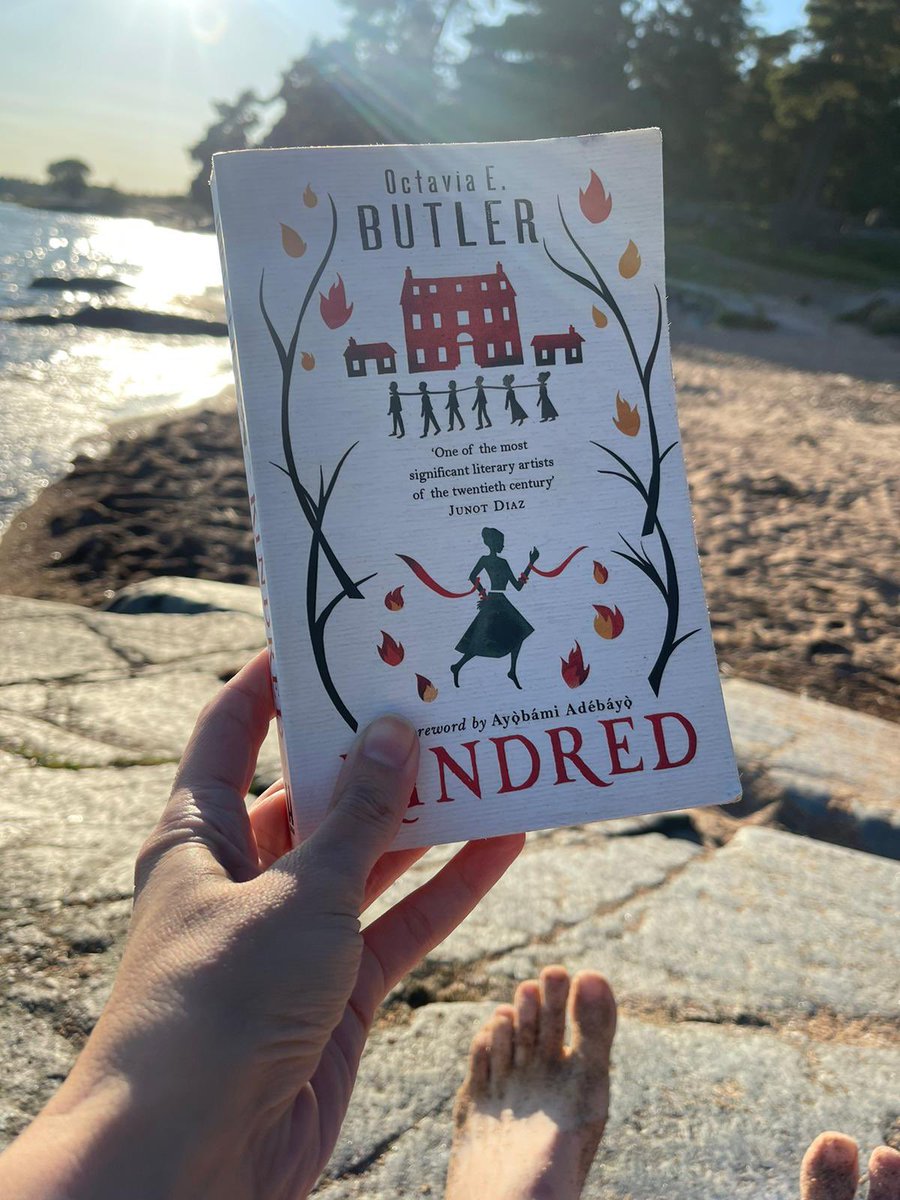 louduffs's tweet photo. Not so subtle “I’m on holiday so you must see the book I’ve just finished in front of a lovely backdrop” tweet. Including a cameo from my finger toes. Book was very challenging in a good and necessary way but I really can’t complain when I got to read a lot of it in this spot https://t.co/BPv4t4OfPR