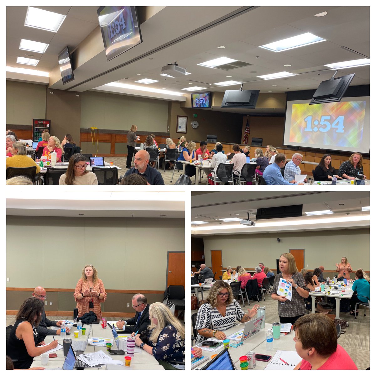 Principals and curriculum specialists engaging an a “speedrun” (5 mins at each station) curriculum update in each content area at Lead Learner meeting