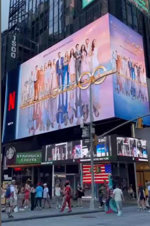 - In July we filmed Carrie-Ann Kay, owner @renekclothing an upcoming video 👗 

- She was finishing a dress for Polly Brindle, star of Selling the OC on <a href="/netflix/">Netflix</a> ☀️

- Now, the same dress has found its place on the world's most iconic billboard in Times Square, New York 🤩 🗽
