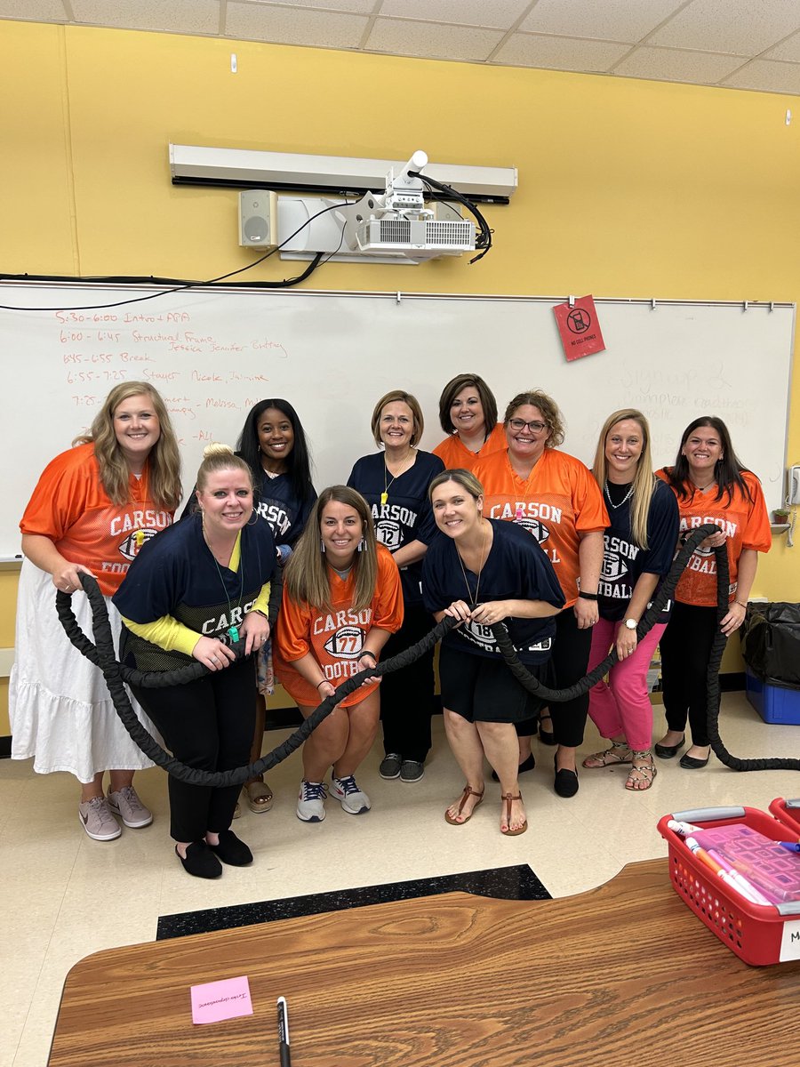 New EdD students sporting their football jerseys as they discuss teamwork in bureaucratic organizations!