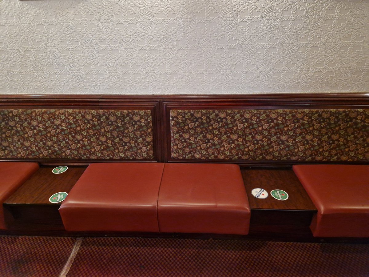 ConorMcGrace's tweet photo. Little bit obsessed with the sofa design in this pub. Built in tables for your pint. https://t.co/uRgwJin0HA