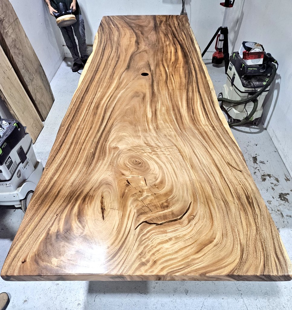 A couple of weeks back, my new coworker and I did this gorgeous 12' x 49" conference table. (He's the one in the back with the oil buffer). It took us the better part of 2 days, but it got done. This monkeypod table has some really great looking grain movement. 
🐻💪🌳💙