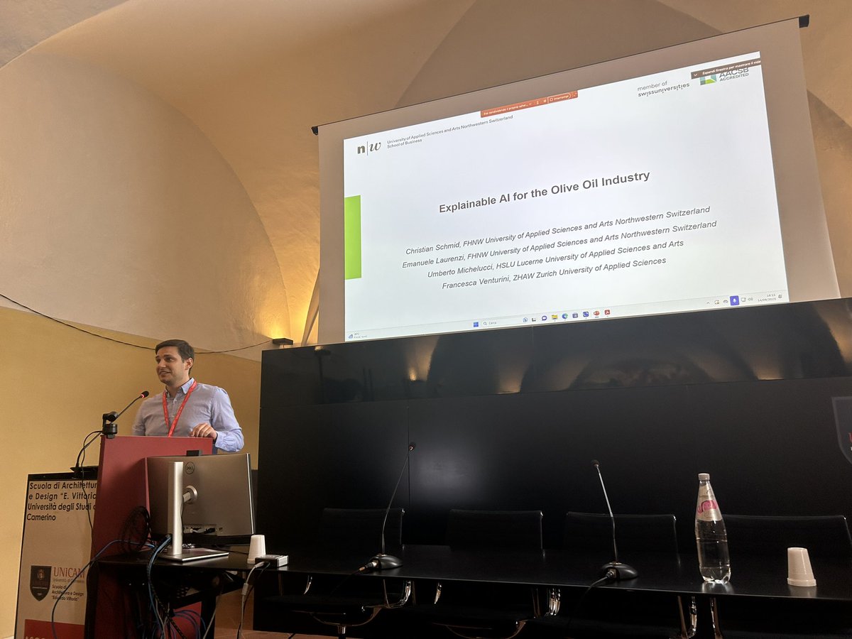 Christian Schmid presenting the paper titled “Explainable AI for the Olive Oil Industry”.