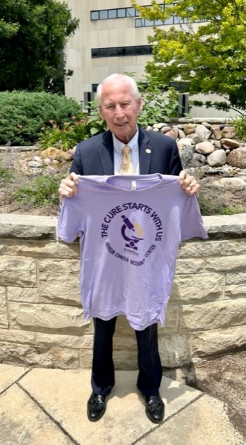 KStateCancerRes's tweet photo. Coach Snyder is boasting our new lavender "The Cure Starts with US!!" Wildcat Challenge game t-shirt.  Get yours today and wear it next week at the home football game vs. UCF!! Go 'CATS!!! https://t.co/MyWpbIWqBT