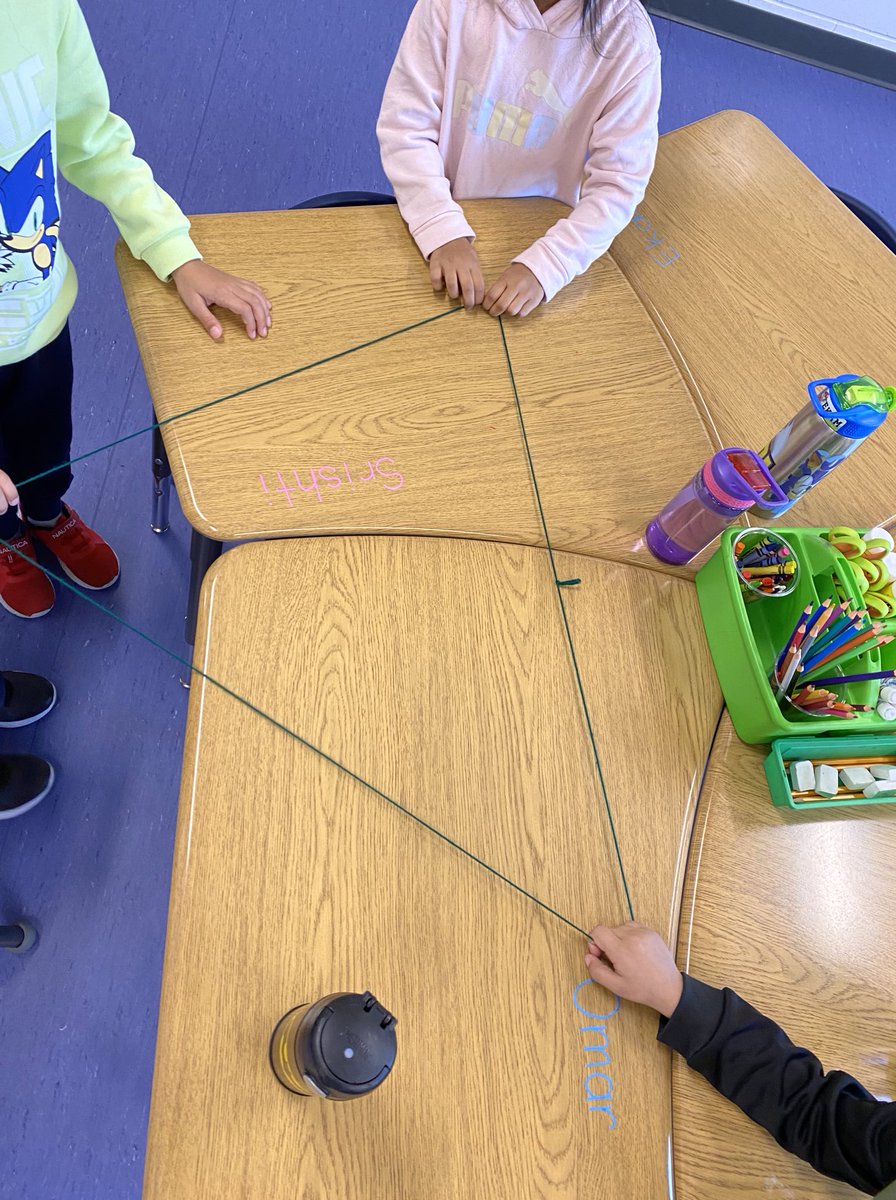 mrspaulitzki's tweet photo. We are building a math community by learning to talk about our ideas, listen to others, work together, and ask questions. Today, students worked in groups to make different shapes using a piece of yarn. Everyone had to be touching the yarn at all times. Awesome teamwork, 1A! https://t.co/0XDzou2D65