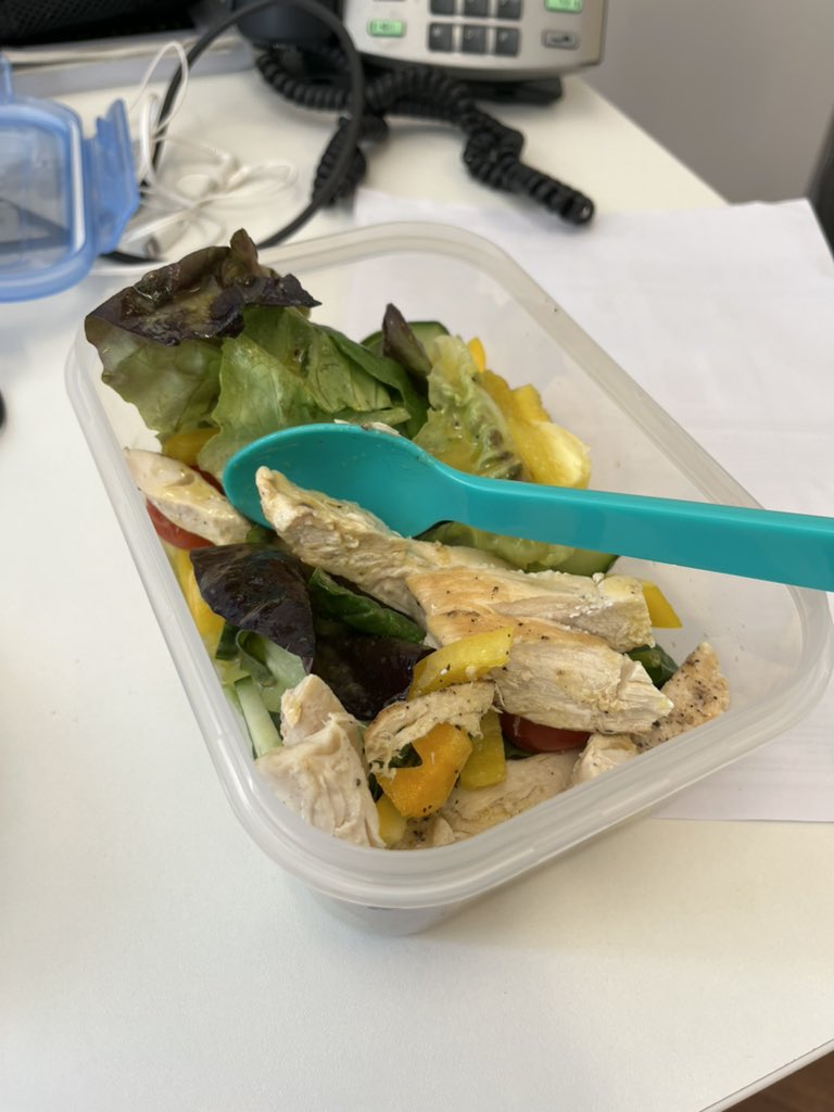 Peak nhs - trying to eat a salad with a plastic spoon.