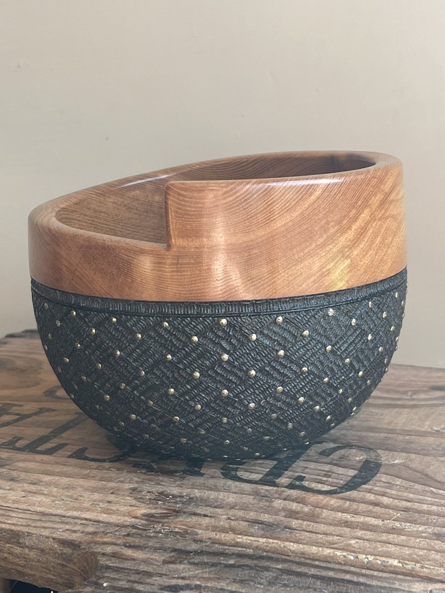 Not posted much on here in a while. An elm pot with carving,pyrography and pins. Oiled and buffed