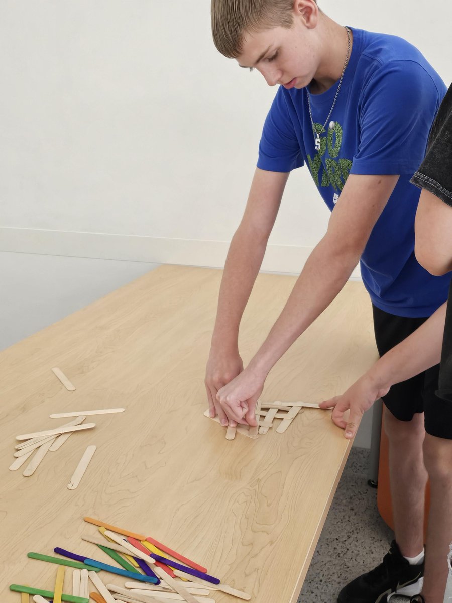 STEAMhigh's tweet photo. Engineering students developing their team working and problem-solving skills. Harnessing energy using only popsicle sticks. We had a lot of "potential" until we let go and became beautifully "kinetic". https://t.co/YAfyVPro7d