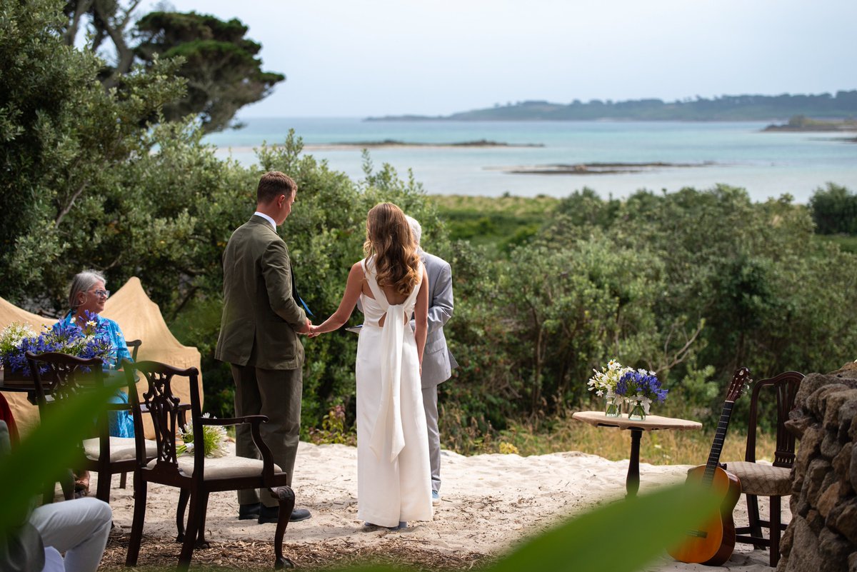 Scillycelebrate's tweet photo. What a lovely view on a sunny summer day for an outdoor wedding! Congratulations to Rosie and Oliver who tied the knot  in July at the Sevenstones Inn on St. Martins. I'm sure there aren't many registrars who travel by boat to conduct a wedding, but we love that part of our work! https://t.co/9nRdn3bFxc
