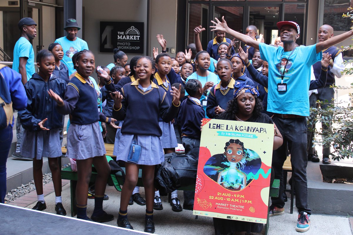 Behind every magical performance is a team that brings it to life! 🎭👫 Here's a heartwarming shot of the "Lehe La Kganyapa" play crew and the talented school children who made this enchanting journey possible, proudly showcasing our poster design.