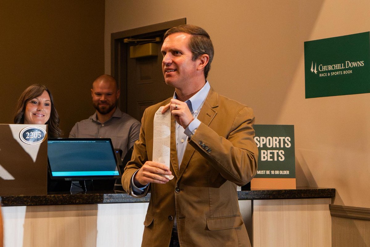 AndyBeshearKY's tweet photo. I just placed the first legal sports bet in Kentucky!

Today, I took the OVER on UofL and UK football wins, and of course the UNDER on Duke. But my bigger bets are on the future of this Commonwealth! https://t.co/U8eVzDQbuR