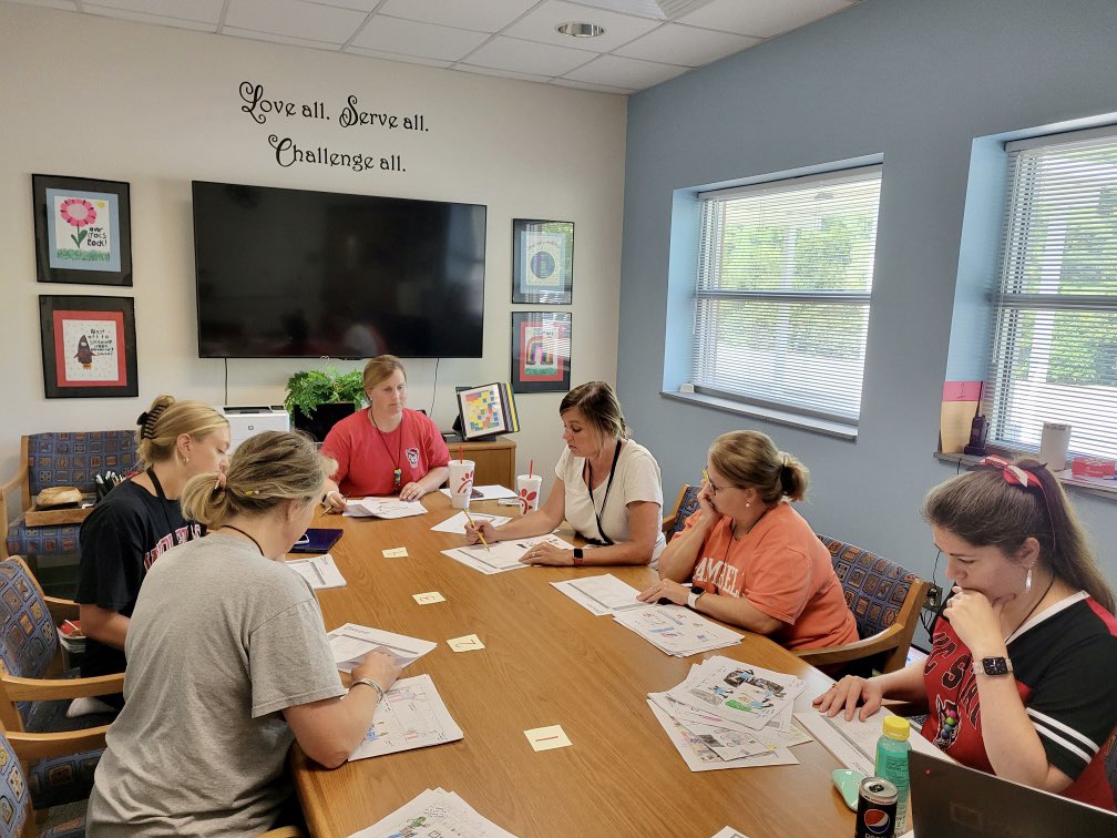 Kindergarten is working hard to plan a family engagement event and collaborating on scoring writing samples.