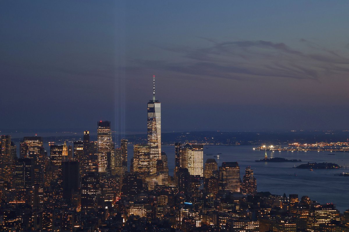 GaryHershorn's tweet image. A comparison of lower Manhattan displaying the Tribute in Light in 2003 for the 2nd anniversary of 9/11 to last night as the 23rd anniversary approaches seen from the Empire State Building #newyork #newyorkcity @Sept11Memorial #tributeinlight @empirestatebldg @agreatbigcity