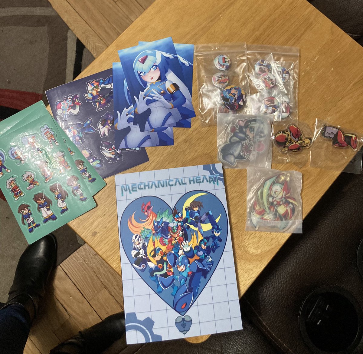 My order from <a href="/MechHeartZine/">Mechanical Heart: A Megaman Zine</a> came! Initially bought the zine with digital merch, but came back to get the mystery bundle. Thanks guys!
