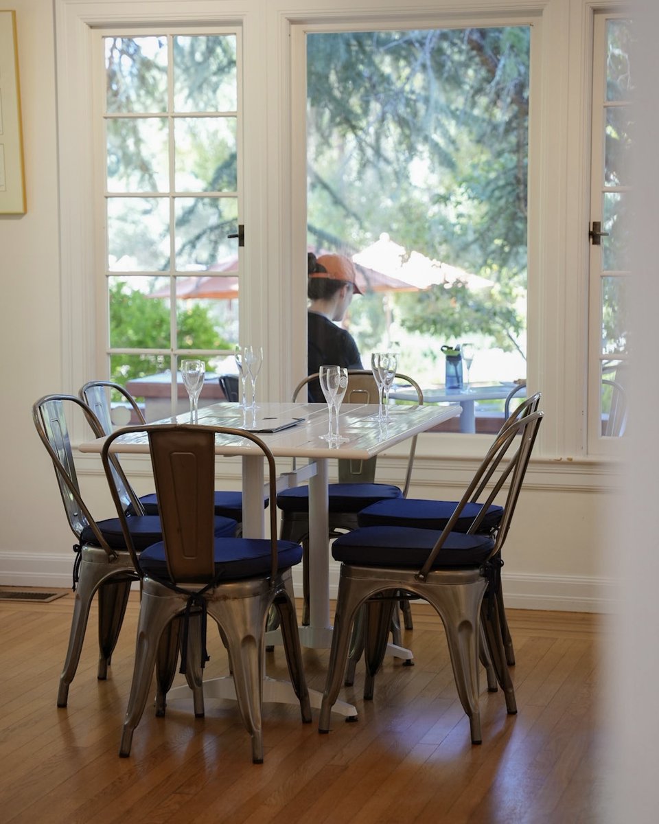 Whether you're #TeamPorch or #TeamAC, we don't make you choose sides! Settle indoors for cool comfort or embrace the breezy bliss on our wrap-around porch. Either way, the sparkling wine will be flowing.🥂🍾