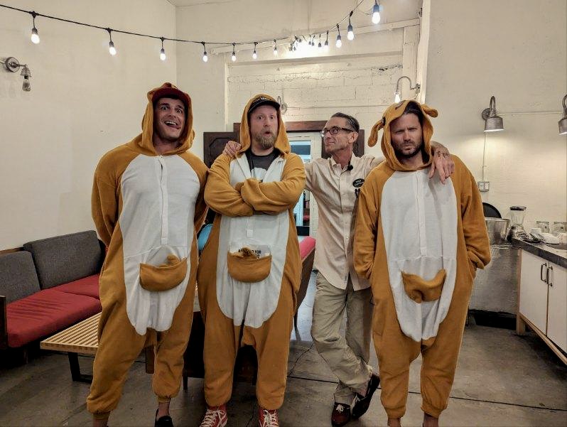 DanJFrazier's tweet photo. I answered @chuckpalahniuk's call to help out at his book tour stop at @RegentTheaterLA. Don't think the audience ever foresaw getting nailed in the face with eyeball beach balls by men in kangaroo onesies. Thank you @BookSoup, @SpacelandLA, &amp; @simonschuster. #ChuckTour2023 https://t.co/fv2d7upujG
