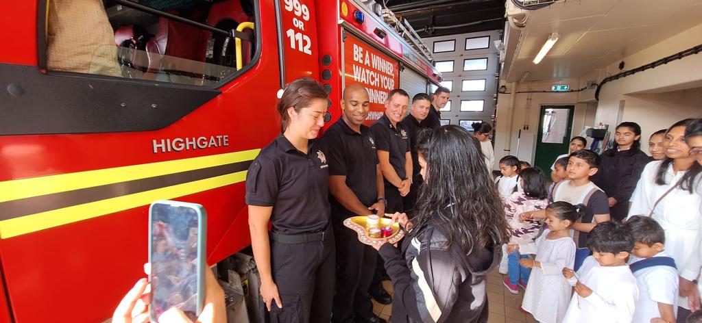 HSS_UK's tweet photo. Radhe Krishna Balgokulam celebrated Raksha Bandhan @ Highgate Community Fire Station, honoring their invaluable service. Young swayamsevaks & sevikas tied rakhis, explored fire trucks 🚒 & equipment. Gratitude to our brave firefighters! #RakshaBandhan #CommunityHeroes #HSSUK https://t.co/kcBaj2KaaW