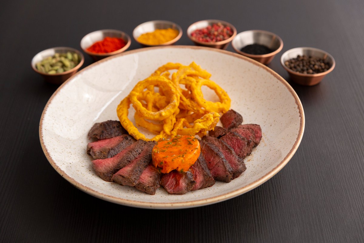 PureCooking's tweet image. Elevate your dining experience with our Venison Steak! Marinated in star anise and nutmeg, served with onion bhaji rings and chili coriander butter. A true gourmet delight. 🦌🌶️ #Pureindiancookingf #VenisonSteak #MeatLovers #CulinaryDelights