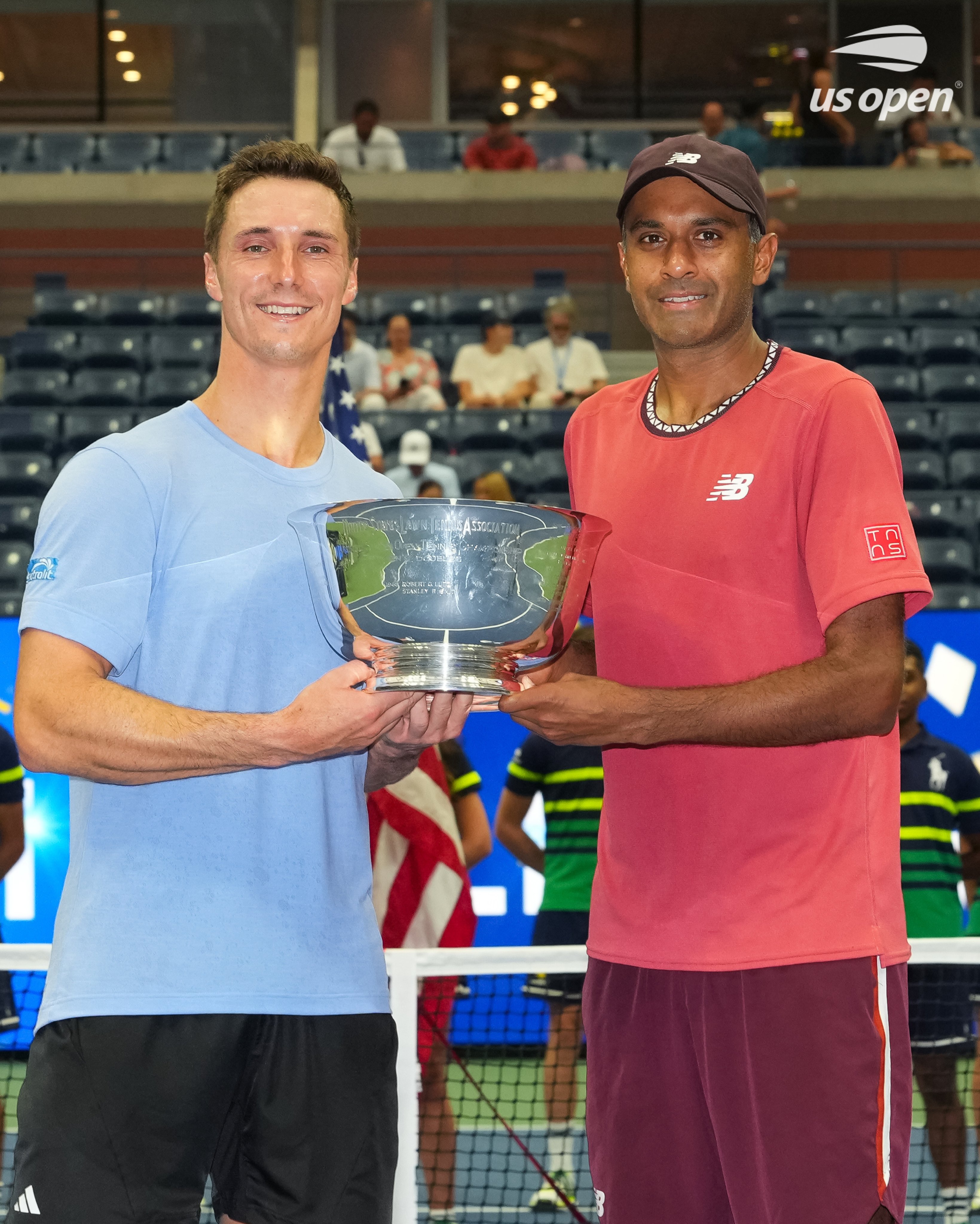 Joe Salisbury and Rajeev Ram holding their US Open trophy. 