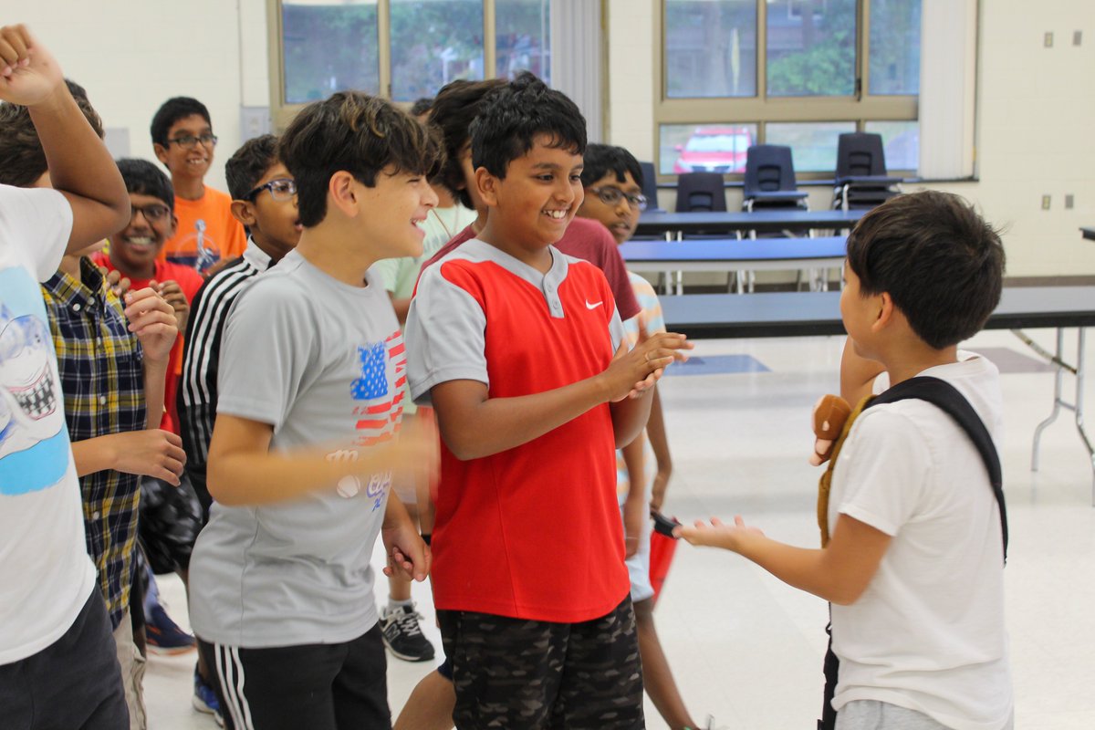Students in the Comets unit at Crossroads North had the chance to learn each other's names today by playing a game of Entourage, which is essentially an ever-expanding 'Rock, Paper, Scissors' competition.