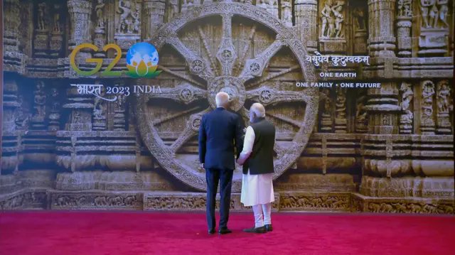 IM_Majhi's tweet photo. The welcome handshake of all leaders with PM Modi will showcase the Konark Wheel from Odisha.  The wheel embodies India's ancient wisdom, advanced civilization, and architectural excellence. It symbolizes time, progress and continuous change. 
#Konark #G20India2023 #odisha https://t.co/hMYYwIpMAc