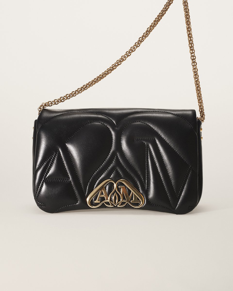 McQueen's tweet photo. The new Seal Bag, a quilted satchel with a #McQueenSeal closure, the emblem of the house and exploded metal hardware.

Discover the #McQueenSeal: https://t.co/9yHrAE4V3V https://t.co/4zr2TkwB9Z