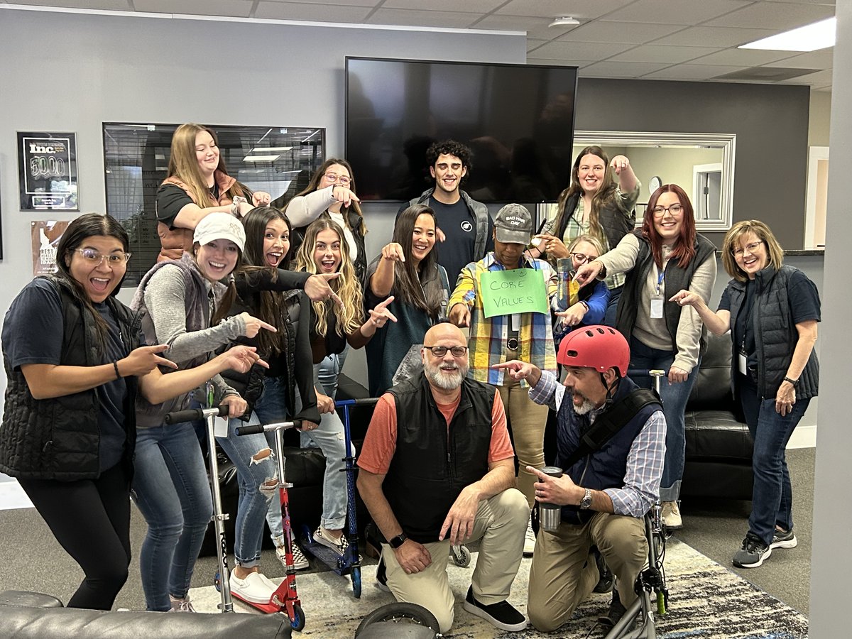 ataraxispeo's tweet photo. This week was Spirit Week at Ataraxis, and we were living one of our core values - Keep it Fun.  Thursday was Glen Scoot Day, in honor of our awesome Chief People Officer.  There were people in vests and riding scooters around the office. #keepitfun #ataraxispeo #WorkFamily https://t.co/Tq8s1YTYHv
