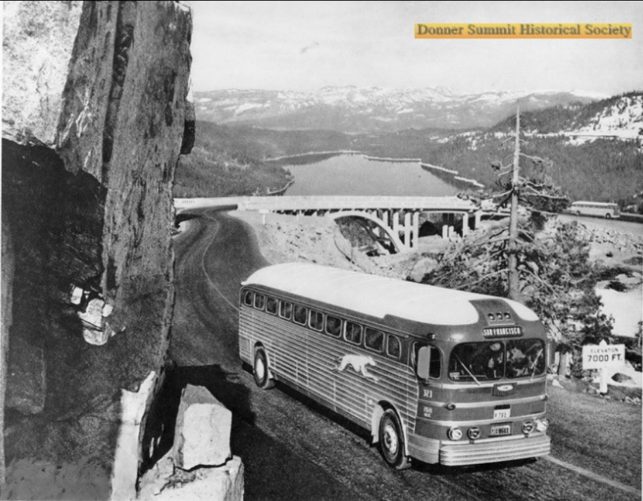 A  "Grey Dog" (Greyhound) climbs old Highway 40 after crossing the Summit Bridge at Donner Summit, c. 1950s. Between 1926 and 1962, this was the main transcontinental route into California before Interstate 80 was finished in 1962. Donner Lake in the background, 7000' elevation