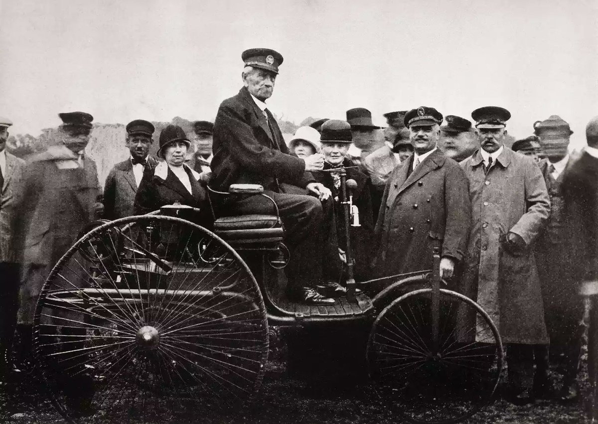 PhysInHistory's tweet photo. The world's first automobile created and driven by Karl Benz was the Benz Patent-Motorwagen, a three-wheeled vehicle powered by a four-stroke gasoline engine. Benz designed and built the engine and the chassis for the car, which he patented in 1886. He also invented many parts of the car, such as the spark plug, the carburetor, the clutch, the radiator, and the gear shift. The car had a top speed of about 8 miles per hour and could seat one driver and two passengers.

Benz first tested his car in public on July 3, 1886, in Mannheim, Germany. He started selling his car to the public in the same year, making it the first commercially available automobile in history. One of his first customers was Emile Roger, a bicycle maker from Paris, who became his agent in France. Benz also received the first driver's license in the world from the Grand Duke of Baden in 1888. The most famous trip made by the Benz Patent-Motorwagen was by Benz's wife, Bertha, who drove it from Mannheim to Pforzheim, a distance of about 66 miles, in August 1888. She did this without her husband's knowledge, to prove that the car was reliable and practical for long-distance travel. She also had to overcome some challenges along the way, such as refueling at pharmacies, repairing a broken chain with a hairpin, and using a shoemaker's leather to fix a brake. Her trip attracted public attention and helped promote Benz's car as a useful invention.

Benz continued to improve his car and produced several models with different features and designs. He also built some racing cars that competed in various events. In 1893, he made his first four-wheeled car, which had a more powerful engine and a steering wheel instead of a tiller. In 1900, Benz & Company became the world's largest manufacturer of automobiles, producing about 600 cars per year.

In 1926, Benz merged his company with Daimler-Motoren-Gesellschaft, which was founded by another German engineer, Gottlieb Daimler. The new company was called Daimler-Benz and produced cars under the brand name Mercedes-Benz. Benz retired from the company in 1906 and started another one with his sons, called C. Benz Söhne (C. Benz Sons). He died in 1929 at the age of 84.

The Benz Patent-Motorwagen is widely regarded as the world's first practical modern automobile and a milestone in the history of transportation. It is now preserved in several museums around the world, such as the Deutsches Museum in Munich and the Science Museum in London.
📷Bettmann Archive/Getty Images