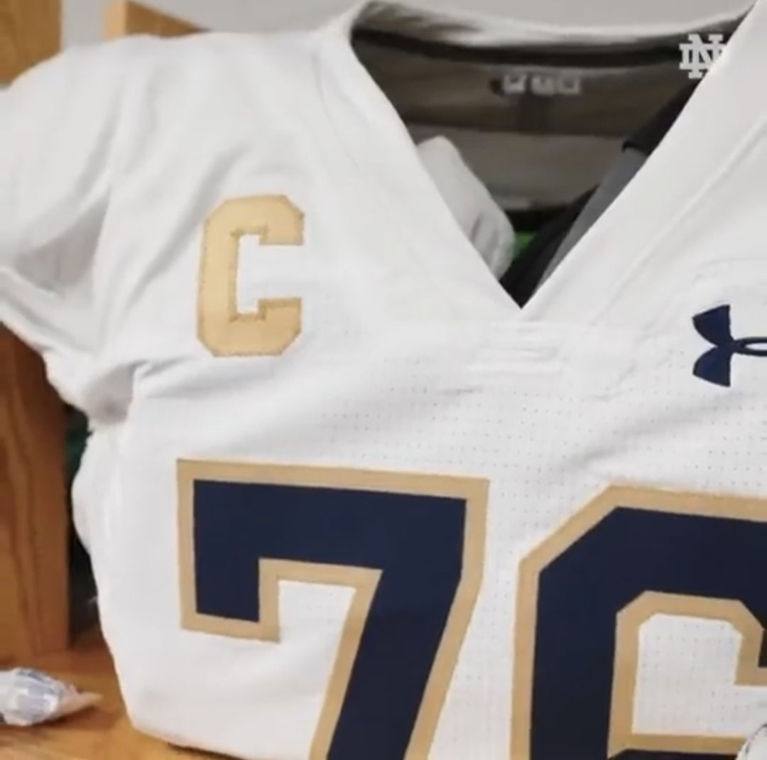 Lenkedup's tweet photo. Looks like @NDFBEquipment has made an on the fly adjustment to the Captain's "C" for at least J. Alt today.  @UniWatch , again, like the contrast look stemming from last week's tearaways. #ndfootball #GoIrish https://t.co/5jdKuN7jU9