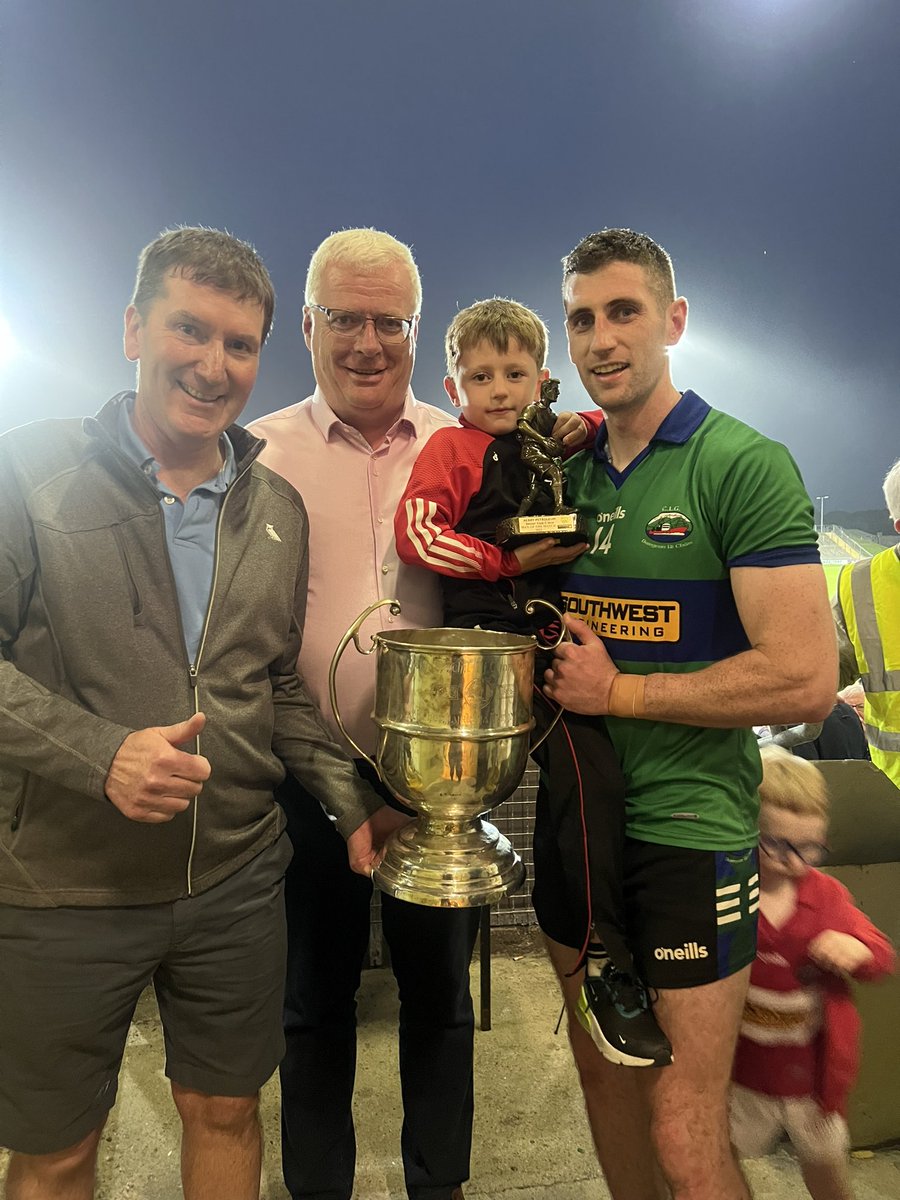 Kerry Petroleum Senior Club Champions @DingleGAA captain Paul Geaney receiving the Michael O’ Connor Cup from Kerry Vice Chair Liam Lynch and also Páidí Geaney reviving the Man of the Match trophy for his dad from Brendan Collins of Kerry Petroleum.