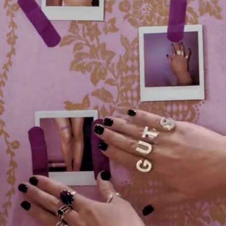 throughout the entire guts era, if olivia attended award shows or events with a purple band-aid or guts rings to represent the era, it would be very iconic and unforgettable