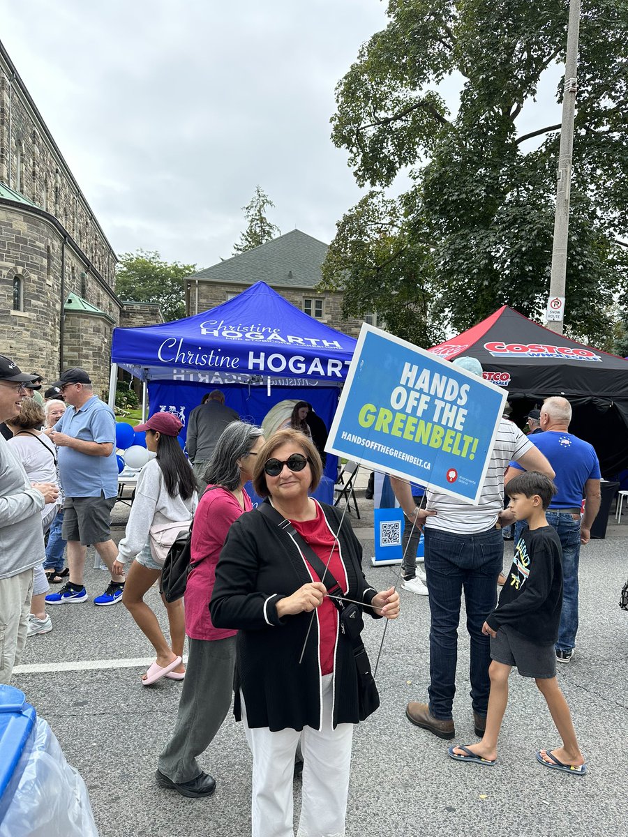 At Taste of the Kingsway and a brave #ongreenbelt supporter is protesting in front of @CHogarthPC’s tent. They called the cops on her.