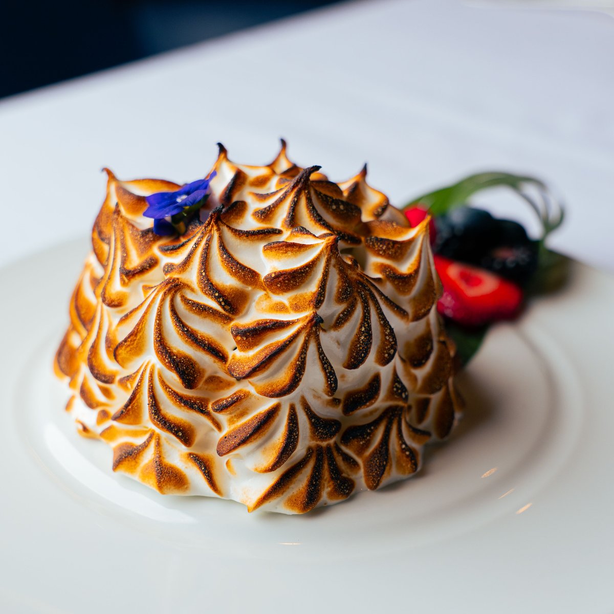 The Baked Alaska is a treat for your taste buds – made with coconut ice cream, pineapple upside down cake and toasted meringue.