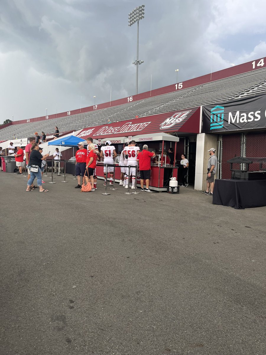 During the weather delay, we have Miami Ohio players being fed by the UMass concession stands.