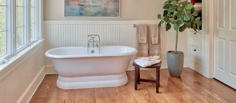 🛀 Hardwood Floors in a Bathroom: Luxurious elegance with a splash of daring! 💎💦 Dare to transform your bathroom oasis with the timeless beauty of hardwood. 🌳🚿 What are your thoughts on hardwood in the bathroom? #HardwoodBathroom #BathLuxury homeflooringpros.com/faqs-about-har…