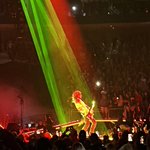 Joe under bright green and red spotlights