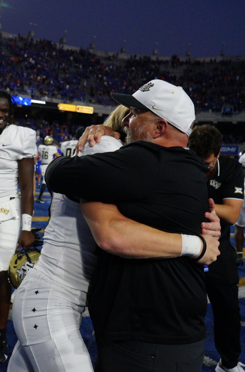 Samboomer1's tweet photo. There is an image that touched me so much this evening - I want to share.  @BenLarsonUCF saw Colton kick @UCF_Football kicking camp 2 years ago and believed in him.  Thank you for all you do Coach Larson. https://t.co/mCubG1r3tA