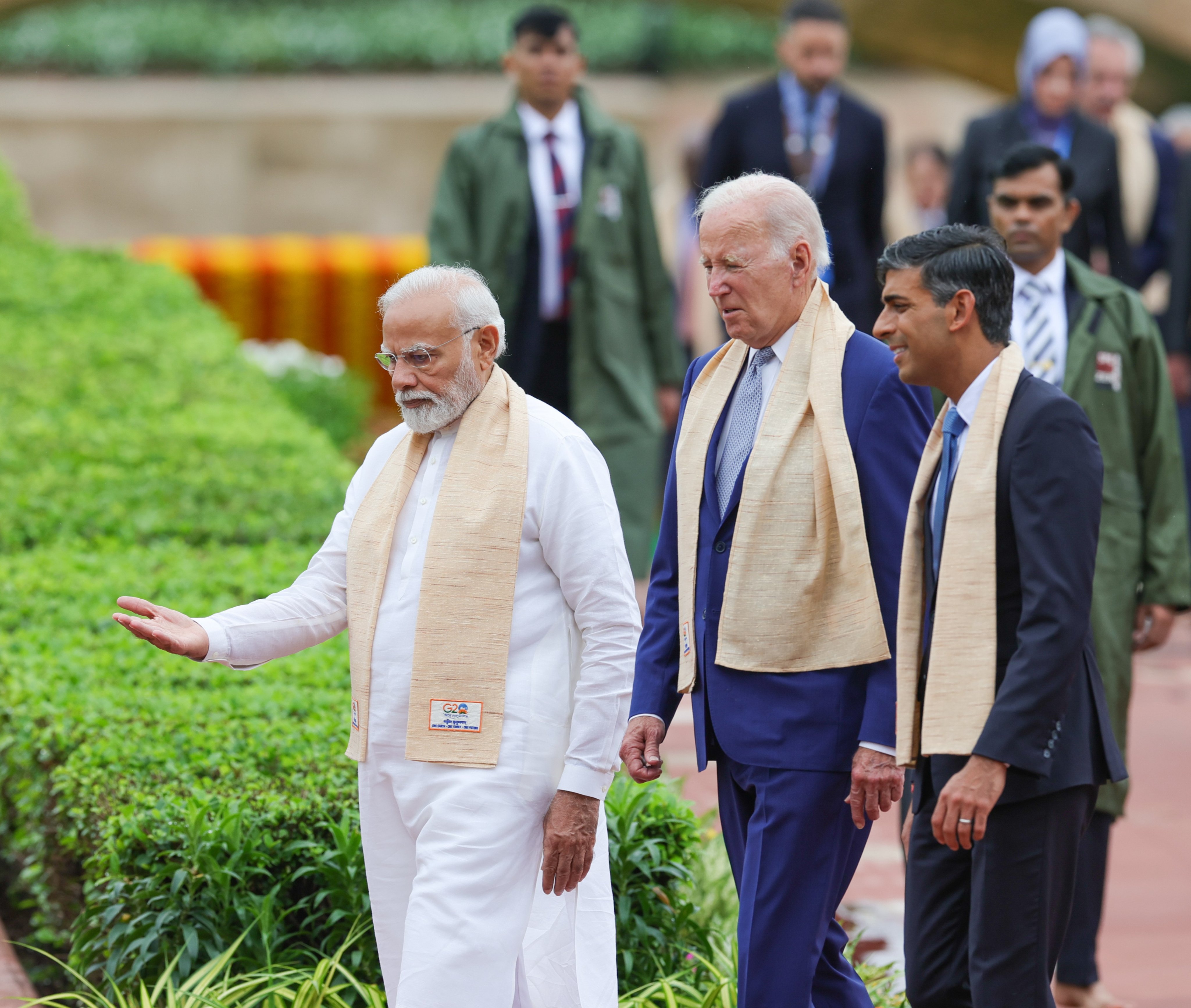 The Prime Minister Rishi Sunak walks with President Biden and Prime Minister Modi at the G20 summit in India