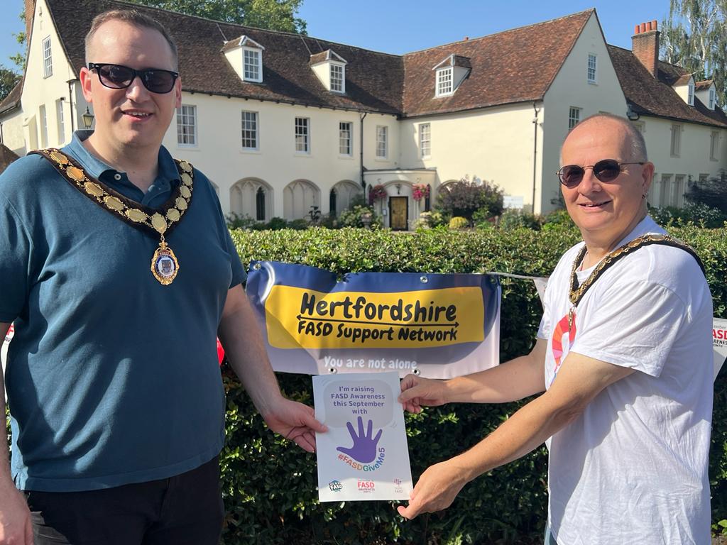 EastFasd's tweet photo. Martin Butcher chair of @EastHerts &amp; Tom Day Mayor of Ware celebrate #FASD day @WareTownCouncil lights the Priory red in solidarity with those living with Foetal Alcohol Spectrum Disorder, the most common neurodisability. @NationalFASD https://t.co/GBwip6QYyS