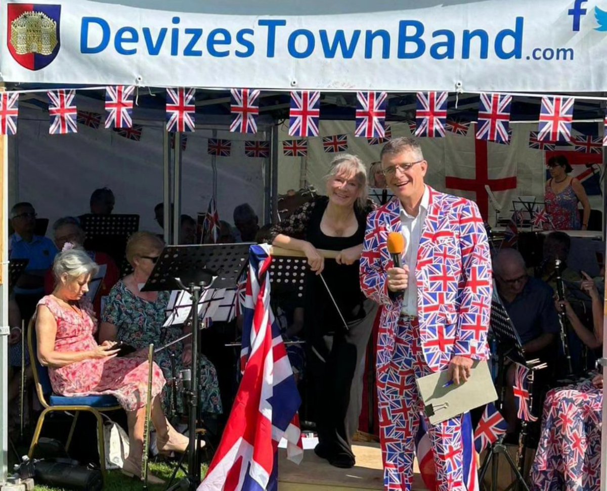 DevizesTownBand's tweet photo. We had a lovely afternoon in @hillworthp for our Proms concert and so did the locals, dressing for the occasion and waving flags!

With Mark Jones of @fantasyradioUK as compere, (you couldn't miss him!) we played what would a proms concert be without the Sea Songs?! https://t.co/a0qisttzDh