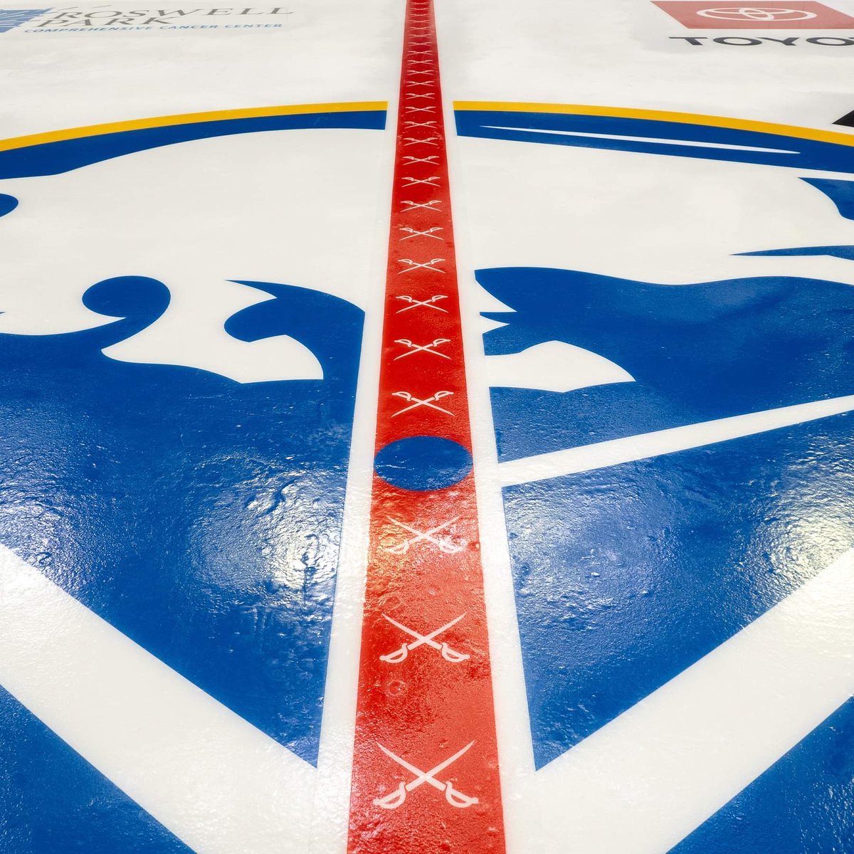 HelmetAddict's tweet photo. Looks like the Sabres did a better job with the Ice logo color this year. Last year it was noticeably dark. Also added crossed swords to the red line. https://t.co/1WV6HROKji