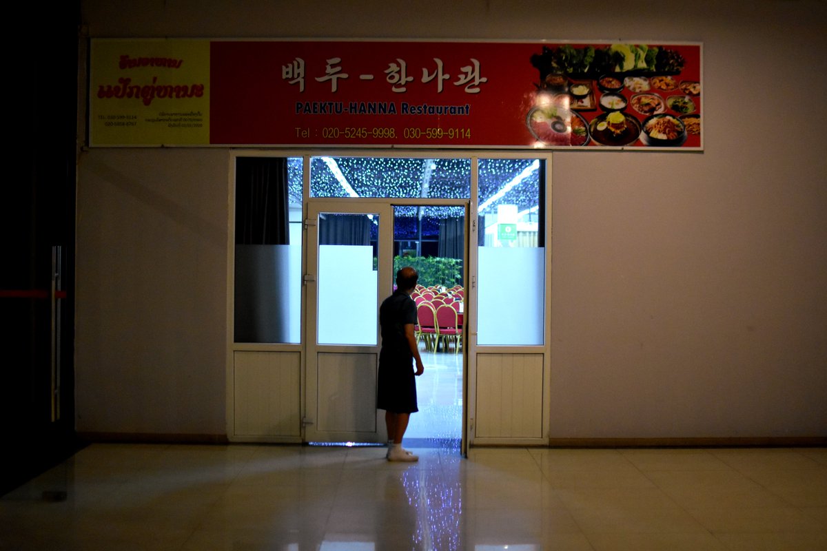 AlMcCready1's tweet photo. There were once North Korean restaurants all across Asia. Today, outside of Russia and China, there are five. Four of those are in Laos (one in Hanoi)—I visited them two weeks ago, and at the risk of falling into NK cliches, they were strange, eerie and baffling places 🧵 https://t.co/lA7pdE3xXk